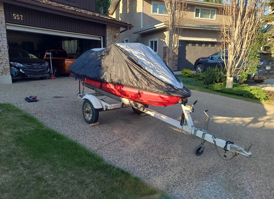 What is the main function of a boat cover?
